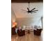 Elegant living room with hardwood floors, a neutral sofa, and a large fan suspended from the vaulted ceiling at 6878 Vic Ar Rd, Atlanta, GA 30360