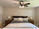Comfortable bedroom featuring a ceiling fan and decor with bedside tables and lamps at 6878 Vic Ar Rd, Atlanta, GA 30360