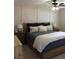 Spacious main bedroom featuring a ceiling fan, wood bed frame, and stylish decor at 6878 Vic Ar Rd, Atlanta, GA 30360