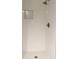Bright white tiled shower with a built-in shampoo niche and chrome fixtures at 6878 Vic Ar Rd, Atlanta, GA 30360