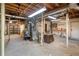 Spacious unfinished basement with utilities, shelving, and work area provides ample storage or customization potential at 6878 Vic Ar Rd, Atlanta, GA 30360