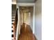 Hallway with wooden floors and multiple doors offers access to rooms in the home at 1870 Garbrooke, Lawrenceville, GA 30046