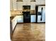 Kitchen features stainless steel appliances, ample cabinet space, and laminate floors at 1870 Garbrooke, Lawrenceville, GA 30046