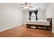 Bedroom with hardwood floors, ceiling fan and window with black curtains at 3650 Ashford Dunwoody Ne Rd # 413, Atlanta, GA 30319