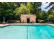 Large community pool surrounded by lush greenery with ample seating at 3650 Ashford Dunwoody Ne Rd # 413, Atlanta, GA 30319