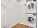 Convenient laundry area featuring stacked washer and dryer with shelving at 3650 Ashford Dunwoody Ne Rd # 413, Atlanta, GA 30319