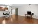 Open-concept living and dining area with hardwood floors and a modern kitchen at 3650 Ashford Dunwoody Ne Rd # 413, Atlanta, GA 30319