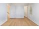 Spacious bedroom offering natural light, hardwood flooring, and versatile layout with multiple entryways at 1077 Mainstreet Valley Dr, Stone Mountain, GA 30088
