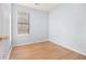 Cozy bedroom filled with natural light with hardwood flooring at 1077 Mainstreet Valley Dr, Stone Mountain, GA 30088