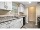 Updated kitchen boasting granite counters, stainless steel appliances, and sleek cabinetry at 1077 Mainstreet Valley Dr, Stone Mountain, GA 30088