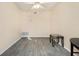 Open living room featuring hardwood flooring, ceiling fan, and neutral walls for a clean, modern appeal at 1077 Mainstreet Valley Dr, Stone Mountain, GA 30088