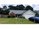 Charming single-story home with a well-manicured lawn, a screened porch, and an attached two-car garage at 20 Bacchus Dr, Lawrenceville, GA 30045