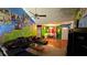 Vibrant living room featuring eclectic decor, a leather sofa, and hardwood floors at 20 Bacchus Dr, Lawrenceville, GA 30045