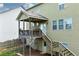 Exterior of back porch and backyard showcasing stairs leading up to the porch with convenient access to backyard at 253 Orchard Trl, Holly Springs, GA 30115