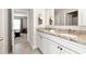 Bathroom featuring double sinks, granite countertops, and modern fixtures at 253 Orchard Trl, Holly Springs, GA 30115