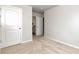 Unfurnished bedroom features neutral carpet and paint, with access to an adjacent bathroom at 253 Orchard Trl, Holly Springs, GA 30115