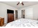 This bedroom features a ceiling fan, carpet, and neutral paint at 253 Orchard Trl, Holly Springs, GA 30115