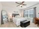 Charming bedroom featuring a queen-sized bed, modern decor, and abundant natural light at 253 Orchard Trl, Holly Springs, GA 30115