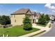 Two story home with a manicured lawn and a long driveway on a sunny day at 253 Orchard Trl, Holly Springs, GA 30115