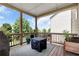 Relaxing screened porch features wood decking and views of the backyard, perfect for enjoying the outdoors at 253 Orchard Trl, Holly Springs, GA 30115