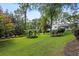 Expansive and well-maintained lawn with mature trees at 263 Mountainview Cir, Canton, GA 30115