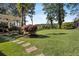 Expansive backyard with lush lawn, mature trees, and a covered patio, perfect for outdoor activities at 263 Mountainview Cir, Canton, GA 30115