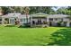 Expansive backyard featuring a covered patio, stone accents, and ample green space at 263 Mountainview Cir, Canton, GA 30115