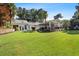 Aerial view of the property showcasing the large backyard, covered patio, and lush landscaping at 263 Mountainview Cir, Canton, GA 30115