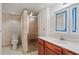Bathroom with a tiled walk-in shower and a vanity with dark wood cabinets at 263 Mountainview Cir, Canton, GA 30115