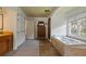 Bright and airy bathroom featuring a soaking tub, double closets, and ample counter space at 263 Mountainview Cir, Canton, GA 30115