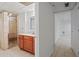 Spacious bathroom featuring tiled floors, shower, vanity, and access to a hallway at 263 Mountainview Cir, Canton, GA 30115