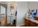 Classic bathroom features a pedestal sink and vintage dresser at 263 Mountainview Cir, Canton, GA 30115