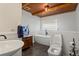 Bright bathroom features a modern soaking tub, toilet, and wood ceiling at 263 Mountainview Cir, Canton, GA 30115