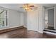 Comfortable bedroom with hardwood floors, a ceiling fan, and an ensuite at 263 Mountainview Cir, Canton, GA 30115