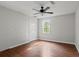 Bedroom with hardwood floors, fresh paint, bright windows, and a ceiling fan at 263 Mountainview Cir, Canton, GA 30115