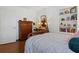 Inviting bedroom showcasing hardwood floors, a vintage dresser, and a comfortable bed, creating a cozy atmosphere at 263 Mountainview Cir, Canton, GA 30115