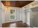 Walk-in closet features custom shelving and hardwood floors at 263 Mountainview Cir, Canton, GA 30115