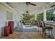 Delightful covered patio area with a bar, rocking chairs and stylish decor for outdoor enjoyment at 263 Mountainview Cir, Canton, GA 30115