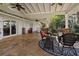 Expansive covered patio with ample seating, ceiling fans, and stylish decor for ultimate comfort at 263 Mountainview Cir, Canton, GA 30115