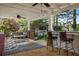 Charming covered patio featuring a bar with seating, ideal for entertaining guests outdoors at 263 Mountainview Cir, Canton, GA 30115