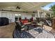 Inviting covered patio with ceiling fans and comfortable wicker furniture, perfect for outdoor relaxation at 263 Mountainview Cir, Canton, GA 30115