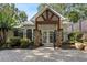 Entrance with stone pillars, decorative iron gate, and a well-manicured garden at 263 Mountainview Cir, Canton, GA 30115