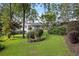 Lush green lawn featuring mature trees and house at 263 Mountainview Cir, Canton, GA 30115