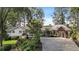 Charming home with lush landscaping, mature trees, and a circular driveway at 263 Mountainview Cir, Canton, GA 30115