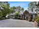 Charming home with a large driveway, stone accents, and mature landscaping, creating an inviting curb appeal at 263 Mountainview Cir, Canton, GA 30115