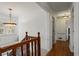 Hallway with hardwood floors and view of a window with shutters at 263 Mountainview Cir, Canton, GA 30115