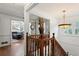 Hallway with view of the living room, hardwood floors, and wood railing at 263 Mountainview Cir, Canton, GA 30115