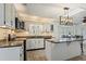 Spacious kitchen featuring granite counters, stainless steel appliances, and bay window breakfast nook at 263 Mountainview Cir, Canton, GA 30115