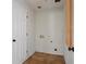 Laundry Room with tile floors, white walls, and utility closet at 263 Mountainview Cir, Canton, GA 30115