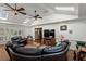 Bright living room features a trey ceiling, wood floors, ceiling fans, skylights, and lots of space at 263 Mountainview Cir, Canton, GA 30115
